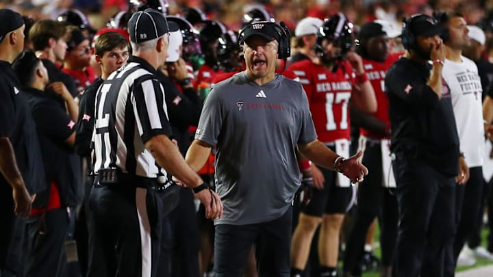 Aug 31, 2024; Lubbock, Texas, USA;  Texas Tech Red Raiders head coach Joey McGuire visits with line judge Jon Stabile in the second half during the game against the Abilene Christian Wildcats at Jones AT&T Stadium and Cody Campbell Field. Mandatory Credit: Michael C. Johnson-USA TODAY Sports