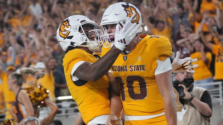 Arizona State quarterback Sam Leavitt (10) celebrates a touchdown with teammate Jordyn Tyson (0). Arizona State quarterback Sam Leavitt (10) celebrates a touchdown with teammate Jordyn Tyson (0).