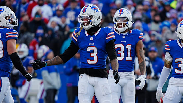 Buffalo Bills safety Damar Hamlin smiles after almost intercepting a. Pass during the second half of the Buffalo Bills wild card game against the Denver Broncos at Highmark Stadium in Orchard Park on Jan. 12, 2025. Behind him are teammates Buffalo Bills cornerback Rasul Douglas and Buffalo Bills cornerback Cam Lewis.