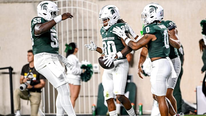 Michigan State's Aveon Grose, center, celebrates after downing a MSU punt inside the 5 yard line against Western Michigan during the third quarter on Friday, Aug. 29, 2025, in East Lansing.