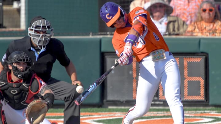 Clemson infielder Josh Paino (8) hits the ball agains University of Louisville during the bottom of the second inning at Doug Kingsmore Stadum in Clemson, S.C. Friday, April 18, 2025.