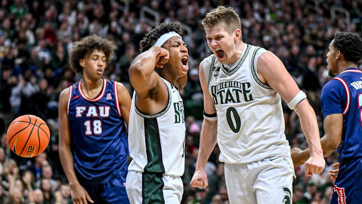 Michigan State's Jeremy Fears Jr., left, celebrates with Jaxon Kohler, right, after Fears' score and a Florida Atlantic foul during the first half on Saturday, Dec. 21, 2024, in East Lansing.