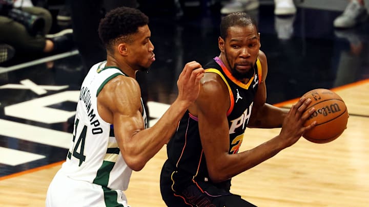 Feb 6, 2024; Phoenix, Arizona, USA; Phoenix Suns forward Kevin Durant (35) drives to the basket against Milwaukee Bucks forward Giannis Antetokounmpo (34) during the second quarter at Footprint Center. Mandatory Credit: Mark J. Rebilas-Imagn Images Feb 6, 2024; Phoenix, Arizona, USA; Phoenix Suns forward Kevin Durant (35) drives to the basket against Milwaukee Bucks forward Giannis Antetokounmpo (34) during the second quarter at Footprint Center. Mandatory Credit: Mark J. Rebilas-Imagn Images