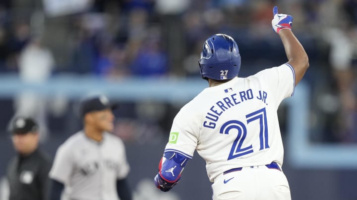 Jun 27, 2024; Toronto, Ontario, CAN; Toronto Blue Jays first baseman Vladimir Guerrero Jr. (27) celebrates his solo home run against the New York Yankees as he runs to second base during the sixth inning at Rogers Centre. Jun 27, 2024; Toronto, Ontario, CAN; Toronto Blue Jays first baseman Vladimir Guerrero Jr. (27) celebrates his solo home run against the New York Yankees as he runs to second base during the sixth inning at Rogers Centre.