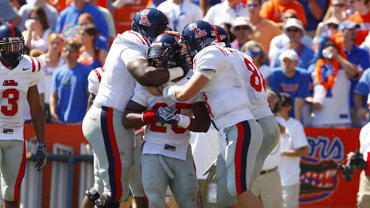 September 27, 2008; Gainesville FL, USA; Mississippi Rebels offensive line John Jerry (77) and quarterback Jevan Snead (4) celebrate with wide receiver Cordera Eason (25) after Eason scored a touchdown against the Florida Gators during the third quarter at Ben Hill Griffin Stadium. Mississippi beat the Gators 31-30. Mandatory Credit: Kim Klement-Imagn Images September 27, 2008; Gainesville FL, USA; Mississippi Rebels offensive line John Jerry (77) and quarterback Jevan Snead (4) celebrate with wide receiver Cordera Eason (25) after Eason scored a touchdown against the Florida Gators during the third quarter at Ben Hill Griffin Stadium. Mississippi beat the Gators 31-30. Mandatory Credit: Kim Klement-Imagn Images