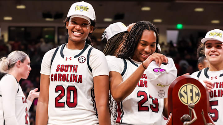 Mar 2, 2025; Columbia, South Carolina, USA; South Carolina Gamecocks forward Sania Feagin (20) and guard Bree Hall (23) try on SEC Championship hats after defeating the Kentucky Wildcats at Colonial Life Arena. Mandatory Credit: Jeff Blake-Imagn Images