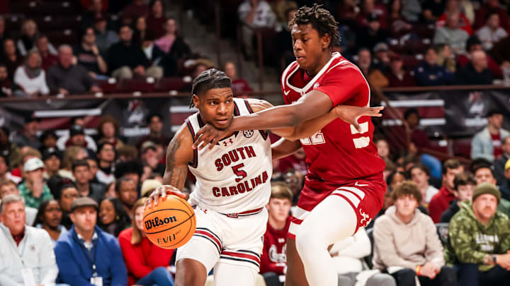 Jan 8, 2025; Columbia, South Carolina, USA; South Carolina Gamecocks forward Nick Pringle (5) drives around Alabama Crimson Tide forward Aiden Sherrell (22) in the first half at Colonial Life Arena. Mandatory Credit: Jeff Blake-Imagn Images Jan 8, 2025; Columbia, South Carolina, USA; South Carolina Gamecocks forward Nick Pringle (5) drives around Alabama Crimson Tide forward Aiden Sherrell (22) in the first half at Colonial Life Arena. Mandatory Credit: Jeff Blake-Imagn Images