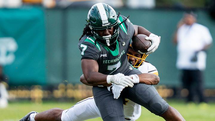Cass Tech junior running back Julian Taylor (7) is tackled by King senior defensive back Don Spillers (4) during the first quarter of a high school football game between Cass Tech and Detroit King at Cass Technical High School in Detroit on Friday, Sept. 25, 2026. Cass Tech junior running back Julian Taylor (7) is tackled by King senior defensive back Don Spillers (4) during the first quarter of a high school football game between Cass Tech and Detroit King at Cass Technical High School in Detroit on Friday, Sept. 25, 2026.