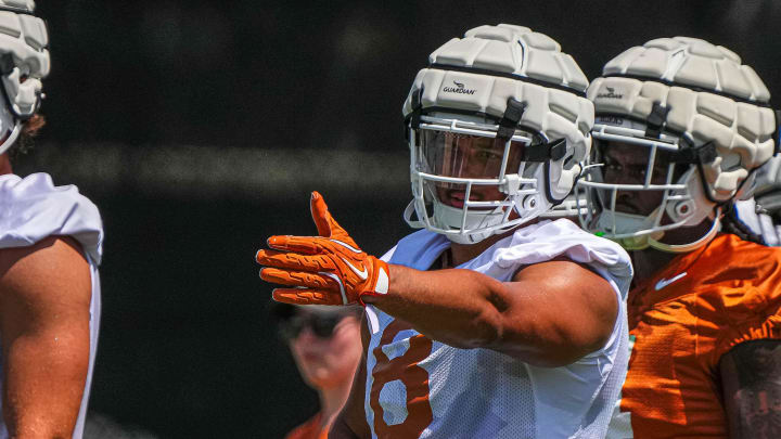 Trey Moore (8) edge for the Texas Longhorns directs team mates during defensive drills at practice at Frank Denius Fields on Thursday, Aug. 1, 2024 in Austin. Trey Moore (8) edge for the Texas Longhorns directs team mates during defensive drills at practice at Frank Denius Fields on Thursday, Aug. 1, 2024 in Austin.