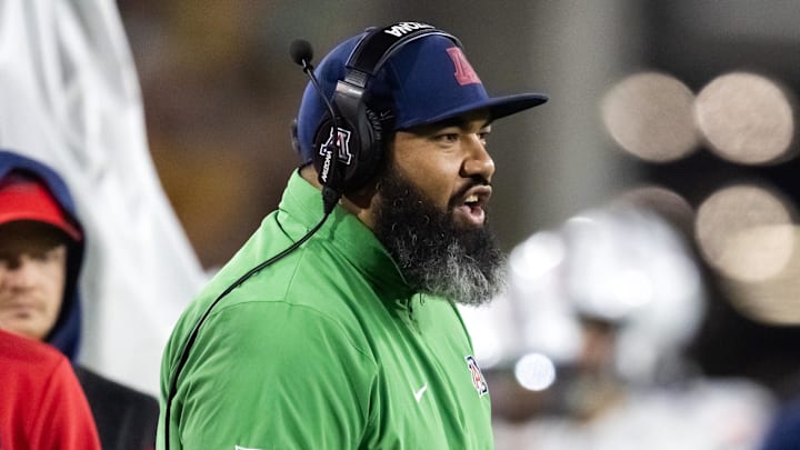 Nov 28, 2025; Tempe, Arizona, USA; Arizona Wildcats assistant coach Lyle Moevao against the Arizona State Sun Devils during the 99th Territorial Cup at Mountain America Stadium. Mandatory Credit: Mark J. Rebilas-Imagn Images Nov 28, 2025; Tempe, Arizona, USA; Arizona Wildcats assistant coach Lyle Moevao against the Arizona State Sun Devils during the 99th Territorial Cup at Mountain America Stadium. Mandatory Credit: Mark J. Rebilas-Imagn Images