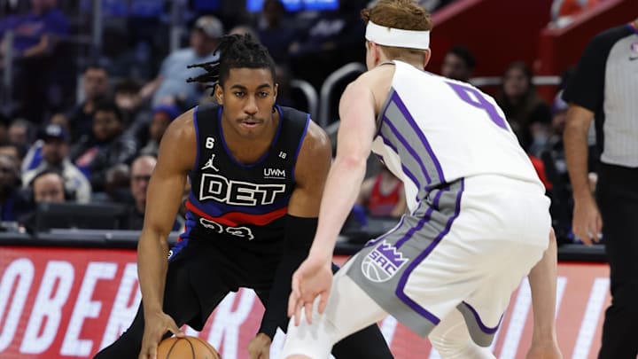 Dec 16, 2022; Detroit, Michigan, USA;  Detroit Pistons guard Jaden Ivey (23) dribbles defended by Sacramento Kings guard Kevin Huerter (9):  Rick Osentoski-Imagn Images