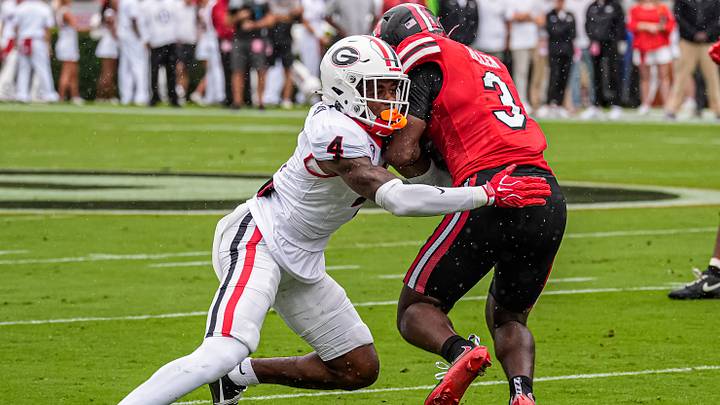 Sep 12, 2026; Athens, Georgia, USA; Georgia Bulldogs defensive back KJ Bolden (4) tackles Western Kentucky Hilltoppers running back Ajay Allen (3) at Sanford Stadium. Mandatory Credit: Dale Zanine-Imagn Images