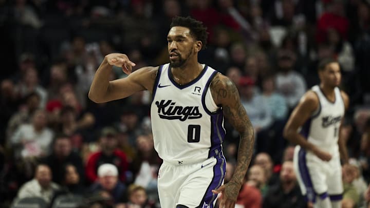 Nov 29, 2024; Portland, Oregon, USA; Sacramento Kings guard Malik Monk (0) reacts after scoring a three point basket during the second half against the Portland Trail Blazers at Moda Center. Mandatory Credit: Troy Wayrynen-Imagn Images