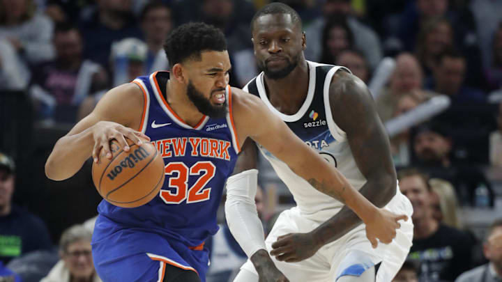 New York Knicks forward Karl-Anthony Towns (32) works around Minnesota Timberwolves forward Julius Randle in the third quarter at Target Center in Minneapolis on Dec. 19, 2024.