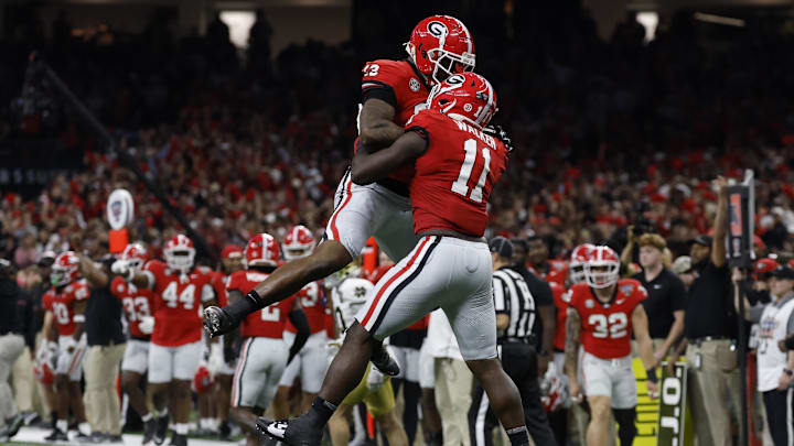 Jan 2, 2025; New Orleans, LA, USA; Georgia Bulldogs linebacker Jalon Walker (11) celebrates with Bulldogs defensive lineman Mykel Williams (13) after making a defensive stop against the Notre Dame Fighting Irish during the first quarter at Caesars Superdome. Mandatory Credit: Geoff Burke-Imagn Images