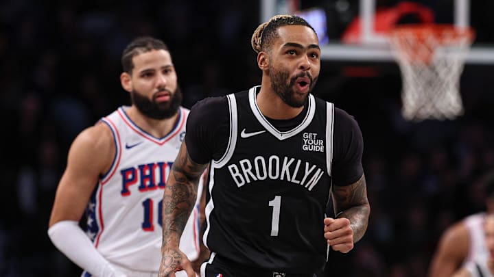 Jan 4, 2025; Brooklyn, New York, USA; Brooklyn Nets guard D'Angelo Russell (1) reacts after making a basket during the first quarter against the Philadelphia 76ers at Barclays Center. Mandatory Credit: Vincent Carchietta-Imagn Images
