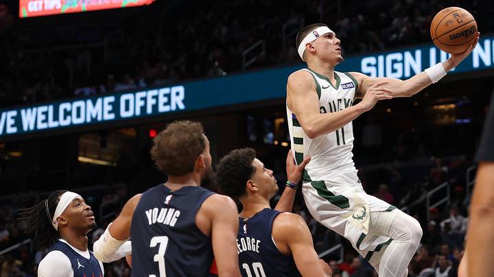 Oct 21, 2026; Washington, District of Columbia, USA; Milwaukee Bucks guard Tyler Herro (11) shoots the ball as Washington Wizards guard Bilal Coulibaly (0) and Wizards guard Trae Young (3) look on in the second half at Capital One Arena. Mandatory Credit: Geoff Burke-Imagn Images