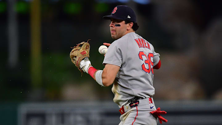Jun 24, 2025; Anaheim, California, USA; Boston Red Sox second baseman Marcelo Mayer (39) loses control of the ball for the throw to first against Los Angeles Angels center fielder Jo Adell (7). during the seventh inning at Angel Stadium. Mandatory Credit: Gary A. Vasquez-Imagn Images