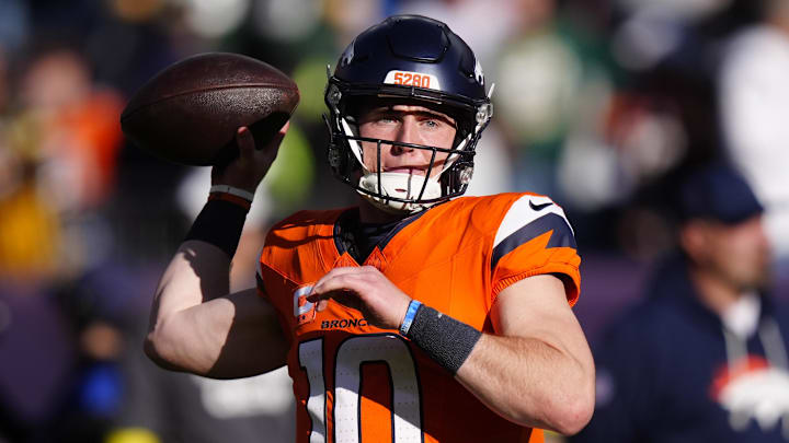 Dec 14, 2025; Denver, Colorado, USA; Denver Broncos quarterback Bo Nix (10) warms up before a game against the Green Bay Packers at Empower Field at Mile High. 