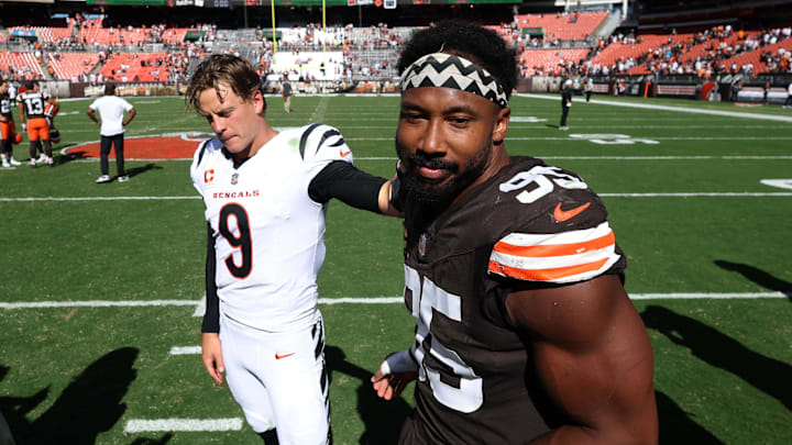 Sep 7, 2025; Cleveland, Ohio, USA; Cincinnati Bengals quarterback Joe Burrow (9) and Cleveland Browns defensive end Myles Garrett (95) greet each other after a game at Huntington Bank Field. Mandatory Credit: Scott Galvin-Imagn Images