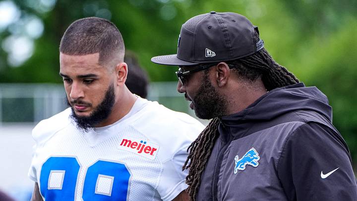 Detroit Lions defensive end Ahmed Hassanein (99), left, talks to defensive coordinator Kelvin Sheppard after practice during mini camp at Meijer Performance Center in Allen Park on Tuesday, June 16, 2026.