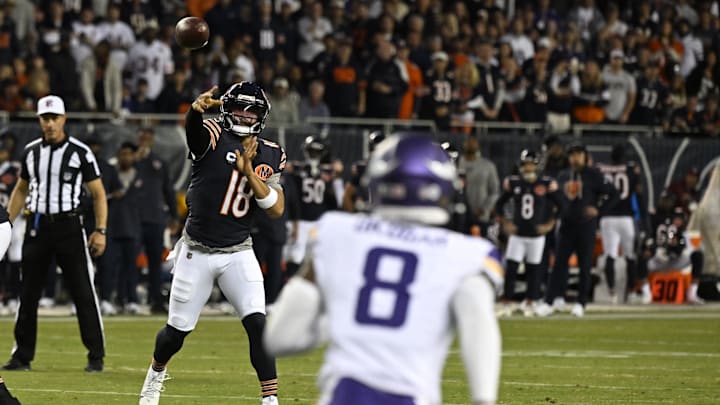Bears quarterback Caleb Williams (18) drops back to pass against the Minnesota Vikings