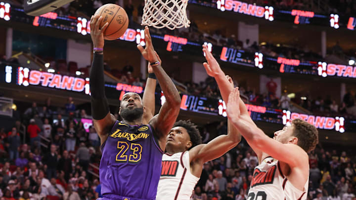 Jan 5, 2025; Houston, Texas, USA: Los Angeles Lakers forward LeBron James (23) makes a basket against Houston Rockets center Alperen Sengun (28) in the fourth quarter at Toyota Center. Mandatory Credit: Thomas Shea-Imagn Images