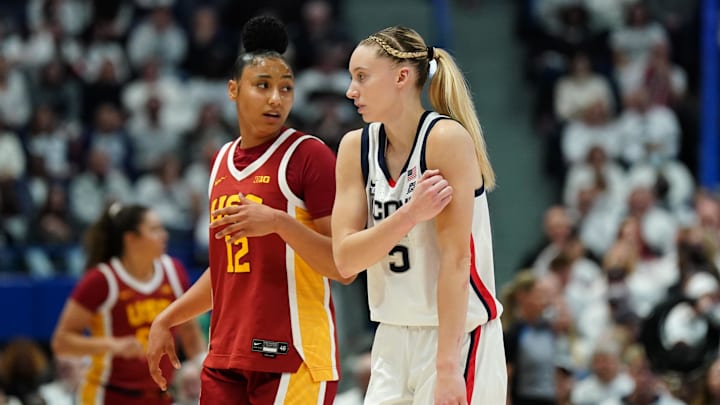 Dec 21, 2024; Hartford, Connecticut, USA; UConn Huskies guard Paige Bueckers (5) and USC Trojans guard JuJu Watkins (12) on the court in the first half at XL Center. Mandatory Credit: David Butler II-Imagn Images Dec 21, 2024; Hartford, Connecticut, USA; UConn Huskies guard Paige Bueckers (5) and USC Trojans guard JuJu Watkins (12) on the court in the first half at XL Center. Mandatory Credit: David Butler II-Imagn Images