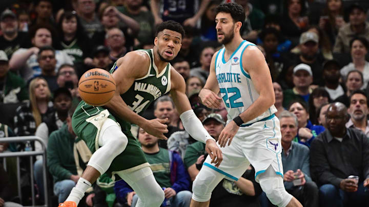 Feb 27, 2024; Milwaukee, Wisconsin, USA; Milwaukee Bucks forward Giannis Antetokounmpo (34) gets pressure from Charlotte Hornets guard Vasilije Micic (22) in the second quarter at Fiserv Forum. Mandatory Credit: Benny Sieu-Imagn Images