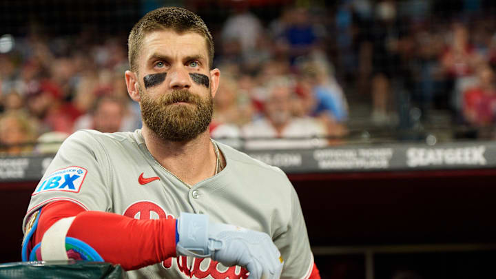 Sep 19, 2025; Phoenix, Arizona, USA;  Philadelphia Phillies infielder Bryce Harper (3) watches on from the dugout before his first at bat of the game against the Arizona Diamondbacks at Chase Field. Mandatory Credit: Allan Henry-Imagn Images