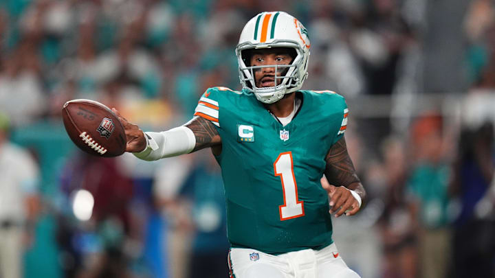 Sep 12, 2024; Miami Gardens, Florida, USA; Miami Dolphins quarterback Tua Tagovailoa (1) tosses the ball during the first half against the Buffalo Bills at Hard Rock Stadium. Mandatory Credit: Jasen Vinlove-Imagn Images Sep 12, 2024; Miami Gardens, Florida, USA; Miami Dolphins quarterback Tua Tagovailoa (1) tosses the ball during the first half against the Buffalo Bills at Hard Rock Stadium. Mandatory Credit: Jasen Vinlove-Imagn Images