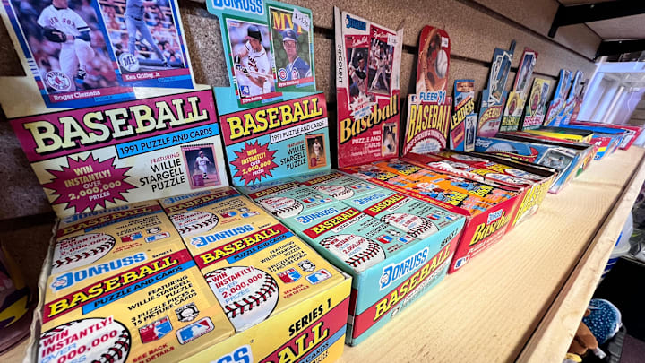 Unopened older baseball cards are for sale at Action Mania Toys and Collectibles.