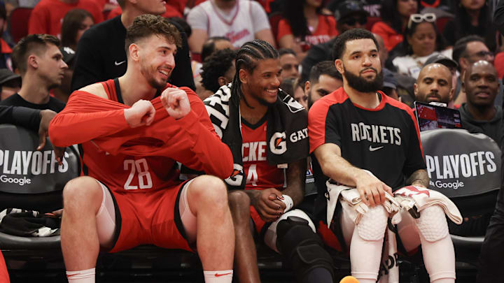 Apr 30, 2025; Houston, Texas, USA; From left to right, Houston Rockets center Alperen Sengun (28) guard Jalen Green (4) and guard Fred VanVleet (5) smile from the bench as their teammates play against the Golden State Warriors in the third quarter during game five of first round for the 2025 NBA Playoffs at Toyota Center. Mandatory Credit: Thomas Shea-Imagn Images