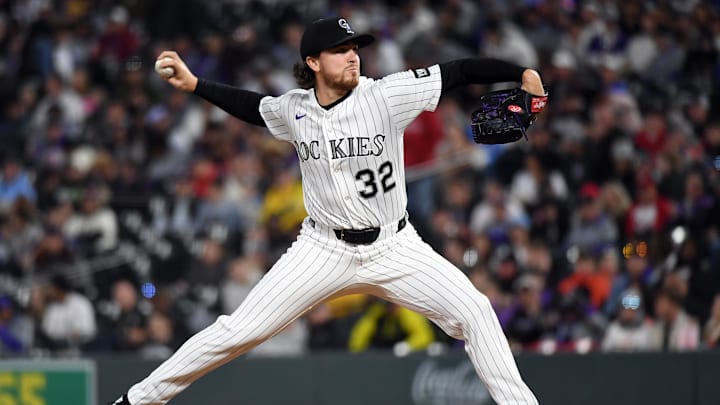 Apr 4, 2026; Denver, Colorado, USA; Colorado Rockies pitcher Chase Dollander (32) pitches during the fifth inning against the Philadelphia Phillies at Coors Field. Mandatory Credit: Christopher Hanewinckel-Imagn Images