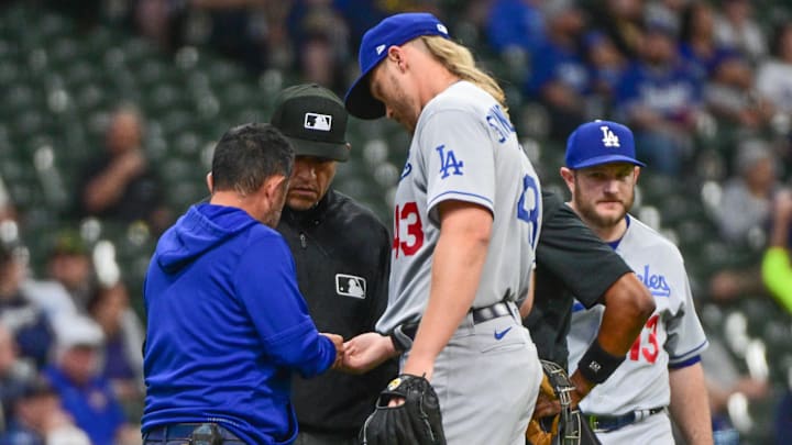 Dodgers pitcher Noah Syndergaard (43) is checked by a trainer in the first inning during game against the Milwaukee Brewers at American Family Field. Syndergaard later left the game with an injury on May 9, 2023. Dodgers pitcher Noah Syndergaard (43) is checked by a trainer in the first inning during game against the Milwaukee Brewers at American Family Field. Syndergaard later left the game with an injury on May 9, 2023.