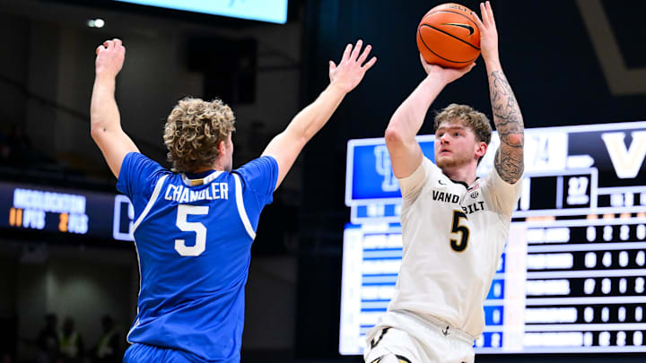 Jan 27, 2026; Nashville, Tennessee, USA;  Vanderbilt Commodores forward Tyler Nickel (5) shoots over Kentucky Wildcats guard Collin Chandler (5) during the second half at Memorial Gymnasium. Mandatory Credit: Steve Roberts-Imagn Images