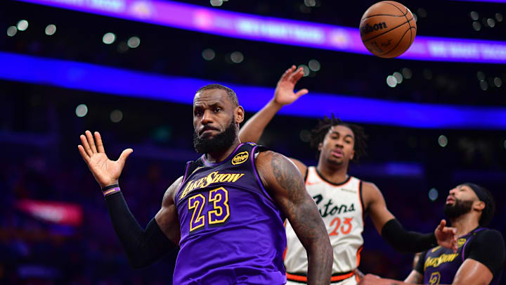 Dec 23, 2024; Los Angeles, California, USA; Los Angeles Lakers forward LeBron James (23) reacts after scoring a basket against the Detroit Pistons during the second half at Crypto.com Arena. Mandatory Credit: Gary A. Vasquez-Imagn Images
