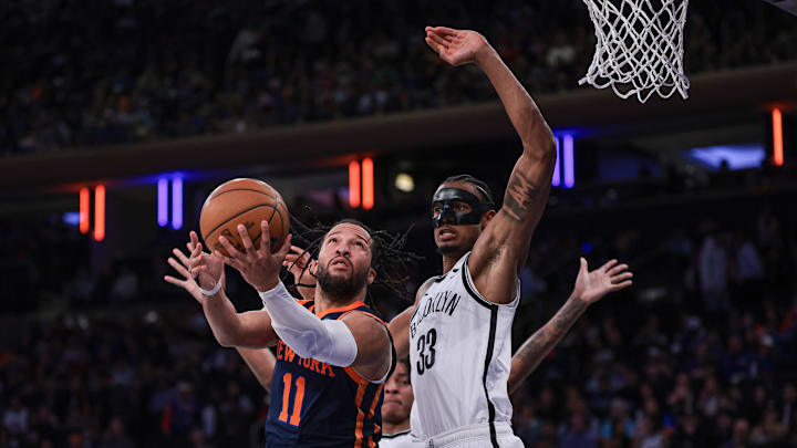 Apr 12, 2024; New York, New York, USA; New York Knicks guard Jalen Brunson (11) drives for a shot against Brooklyn Nets center Nic Claxton (33) during the second half at Madison Square Garden. Mandatory Credit: Vincent Carchietta-Imagn Images