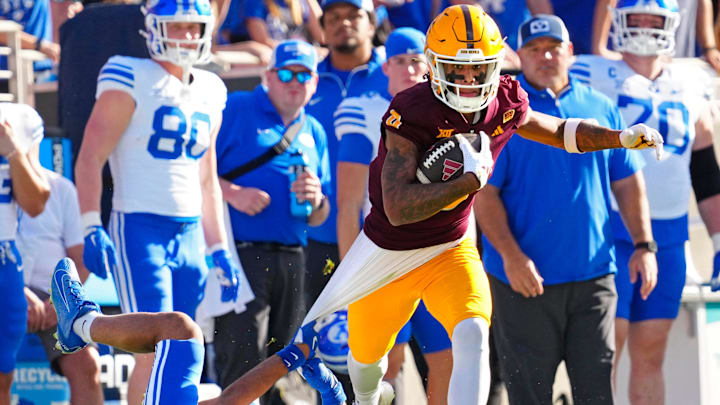 Arizona State wide receiver Jordyn Tyson (0) runs downfield after a catch against BYU safety Raider Damuni (3) during the first half at Mountain America Stadium in Tempe on Nov. 23, 2024. Arizona State wide receiver Jordyn Tyson (0) runs downfield after a catch against BYU safety Raider Damuni (3) during the first half at Mountain America Stadium in Tempe on Nov. 23, 2024.