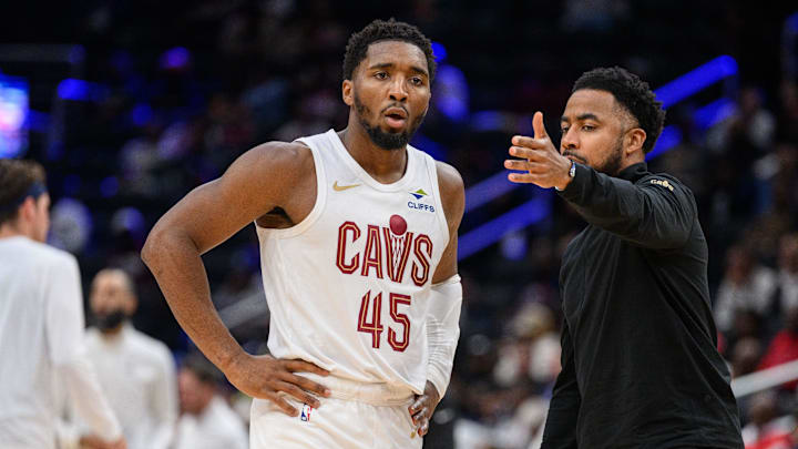 Oct 26, 2024; Washington, District of Columbia, USA; Cleveland Cavaliers guard Donovan Mitchell (45) speaks to Cleveland Cavaliers associate head coach Johnnie
Bryant during a time out in the third quarter against the Washington Wizards at Capital One Arena. Mandatory Credit: Reggie Hildred-Imagn Images
