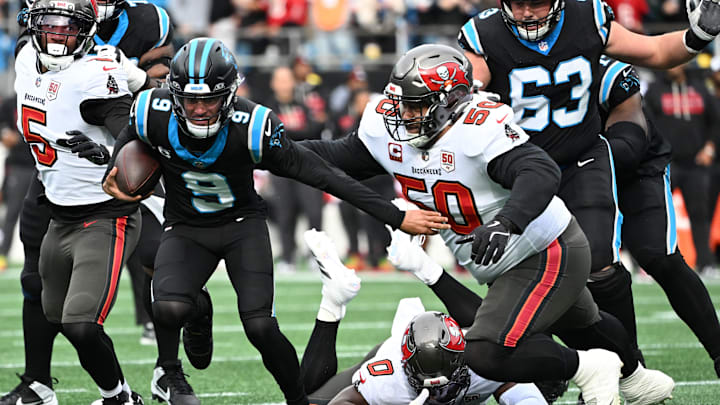 Dec 21, 2025; Charlotte, North Carolina, USA; Carolina Panthers quarterback Bryce Young (9) runs against Tampa Bay Buccaneers defensive tackle Vita Vea (50) during the first half at Bank of America Stadium. Mandatory Credit: Bob Donnan-Imagn Images