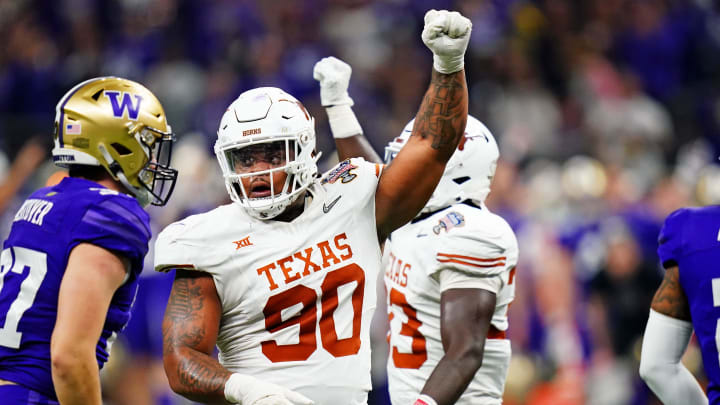 Jan 1, 2024; New Orleans, LA, USA; Texas Longhorns defensive lineman Byron Murphy II (90) celebrates after a play during the second quarter in the 2024 Sugar Bowl college football playoff semifinal game at Caesars Superdome. Jan 1, 2024; New Orleans, LA, USA; Texas Longhorns defensive lineman Byron Murphy II (90) celebrates after a play during the second quarter in the 2024 Sugar Bowl college football playoff semifinal game at Caesars Superdome.