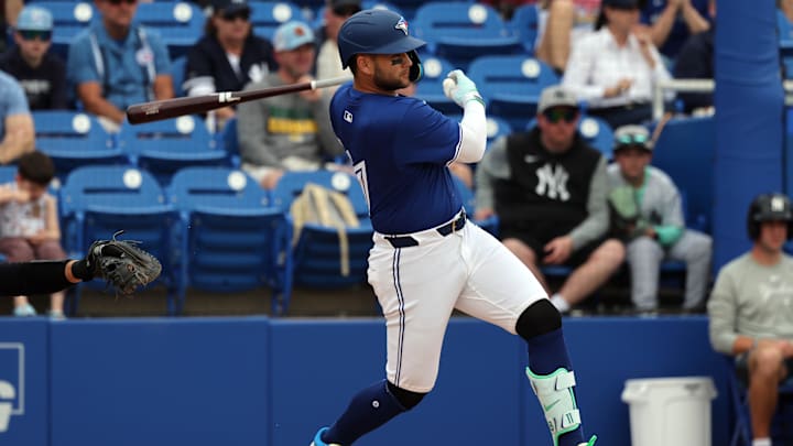 Feb 22, 2025; Dunedin, Florida, USA;Toronto Blue Jays shortstop Bo Bichette (11) reaches base on error against the New York Yankees during the third inning at TD Ballpark. 