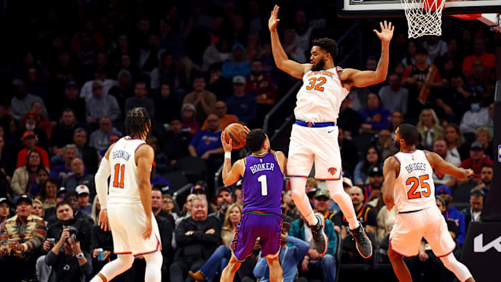 Nov 20, 2024; Phoenix, Arizona, USA; Phoenix Suns guard Devin Booker (1) shoots the ball against New York Knicks center Karl-Anthony Towns (32) during the third quarter at Footprint Center. Mandatory Credit: Mark J. Rebilas-Imagn Images Nov 20, 2024; Phoenix, Arizona, USA; Phoenix Suns guard Devin Booker (1) shoots the ball against New York Knicks center Karl-Anthony Towns (32) during the third quarter at Footprint Center. Mandatory Credit: Mark J. Rebilas-Imagn Images