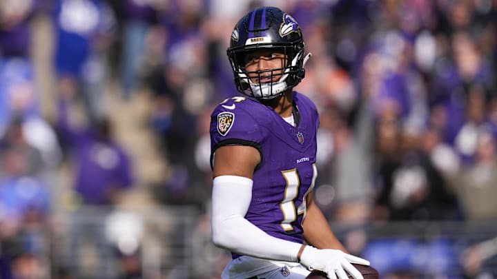 Nov 12, 2023; Baltimore, Maryland, USA;  Baltimore Ravens safety Kyle Hamilton (14) celebrates after scoring a touchdown against the Cleveland Browns during the first quarter at M&T Bank Stadium. Mandatory Credit: Jessica Rapfogel-Imagn Images