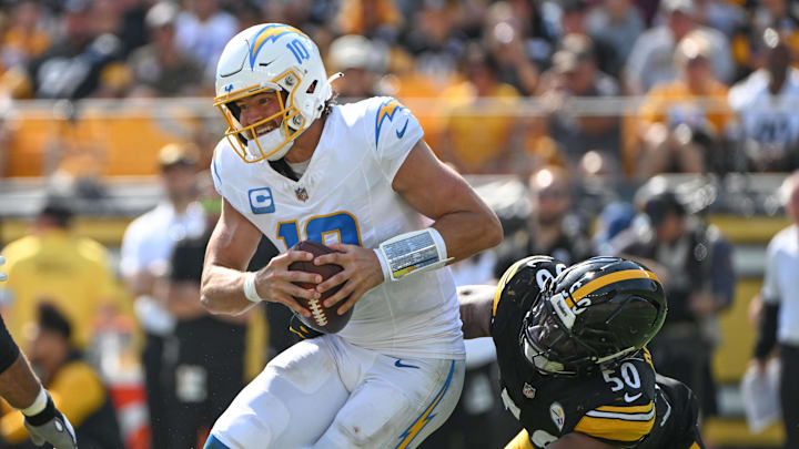 Sep 22, 2024; Pittsburgh, Pennsylvania, USA; Pittsburgh Steelers linebacker Elandon Roberts (50) sacks Los Angeles Chargers quarterback Justin Herbert (10) during the third quarter at Acrisure Stadium. Mandatory Credit: Barry Reeger-Imagn Images