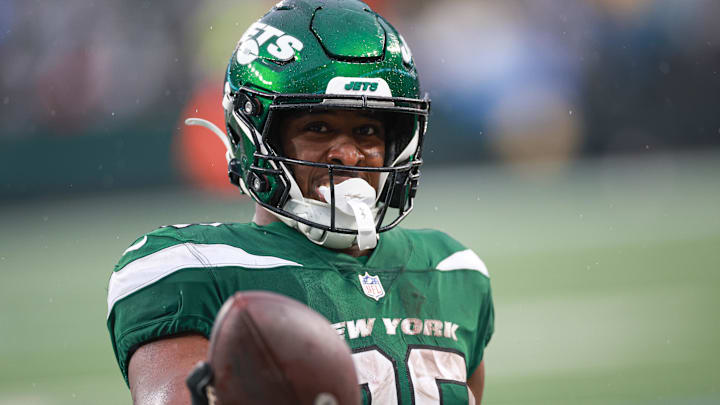 Dec 10, 2023; East Rutherford, New Jersey, USA; New York Jets running back Breece Hall (20) celebrates after a touchdown reception during the second half against the Houston Texans at MetLife Stadium. Mandatory Credit: Vincent Carchietta-Imagn Images