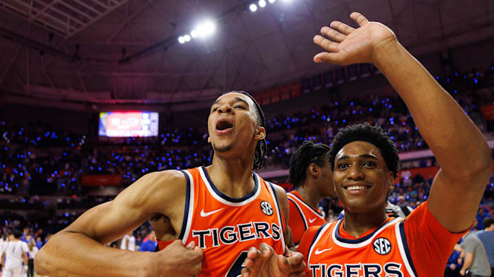 Jan 24, 2026; Gainesville, Florida, USA; Auburn Tigers guard Elyjah Freeman (6) and Auburn Tigers guard Tahaad Pettiford (0) gesture towards the student section after a game against the Florida Gators at Exactech Arena at the Stephen C. O'Connell Center. Mandatory Credit: Matt Pendleton-Imagn Images