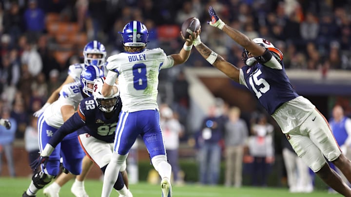 Auburn Tigers defensive end Keldric Faulk (15) tries to block the pass of Kentucky Wildcats quarterback Cutter Boley