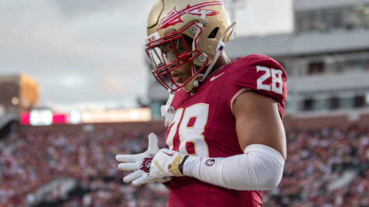 Florida State linebacker Justin Cryer (28) warming up before the rivalry match between No. 18 Florida State University and No. 3 University of Miami.